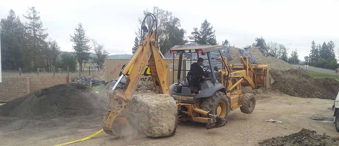Bazzani Building Company moving old concrete pilings at Valero Gas Station in Windsor, CA